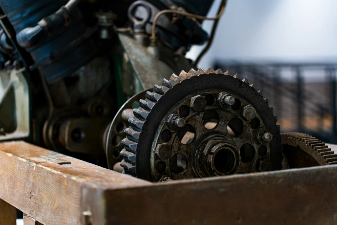 Engine gears are displayed inside of a box.